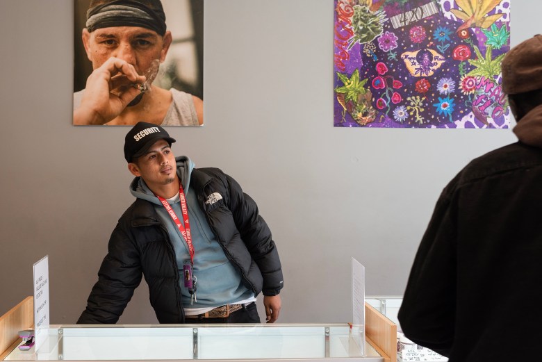 Anthony Bernardo welcomes customers at a cannabis dispensary in downtown San Francisco on April 10, 2024. Photo by Laure Andrillon for CalMatters