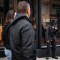 A security guard stands by the front entrance of a luxury retail storefront in downtown San Francisco on April 15, 2024. Retail theft has plagued the area, and numerous storefronts sit vacant. Photo by Loren Elliott for CalMatters