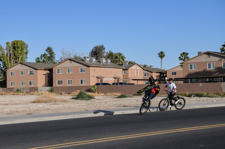 Youthful cyclists ride through the afternoon sun in Blythe on May 8, 2023. Some residents and local leaders say that Chuckawalla Valley State Prison’s closure will also impact the quality of education and opportunities for the youth living in Blythe. Photo by Pablo Unzueta for CalMatters