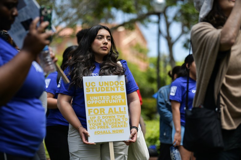 Students rallied with undocumented students, urging University of California leaders to remove hiring restrictions for undocumented students in front of Kerckhoff Hall at UCLA in Los Angeles on May 17, 2023. Photo by Pablo Unzueta for CalMatters