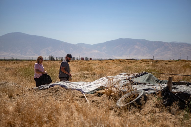 The Akido street medicine team checking on a homeless encampment in a dirt field in Arvin on May 28, 2024. Street medicine teams throughout California are increasingly using long-acting injectable antipsychotic medication to stabilize the mental health of people living in homeless encampments. Photo by Larry Valenzuela, CalMatters/CatchLight Local