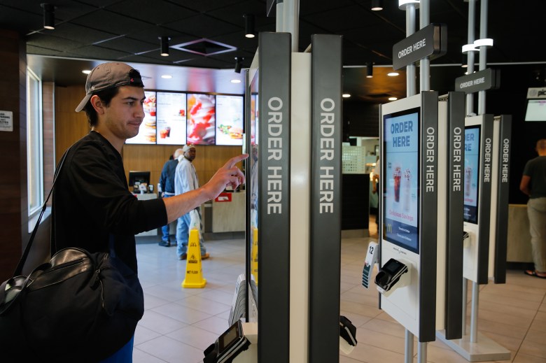 Brandon Alba orders food at a self-service kiosk at a McDonald's restaurant in Chicago. on June 1, 2017. Photo by Charles Rex Arbogast, AP Photo