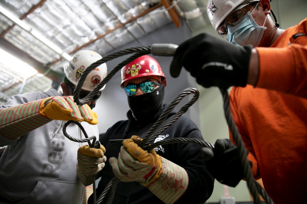 Apprentices sort through wire ropes called chokers at Iron Workers in Benicia on June 20, 2021. Photo by Anne Wernikoff, CalMatters