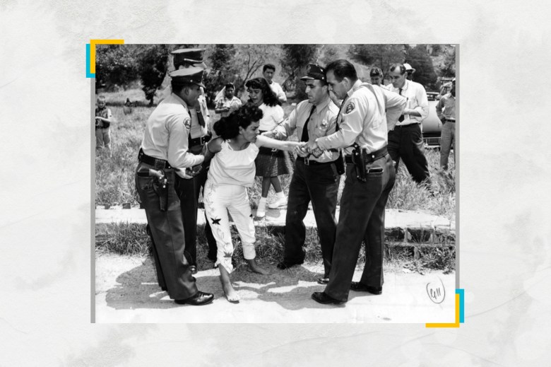 L.A. County Sheriffs forcibly remove Aurora Vargas from her home in Chavez Ravine in 1959. Bulldozers then knocked over the few remaining dwellings; four months later, ground-breaking for Dodger Stadium began. Photo via Herald-Examiner Collection, Los Angeles Public Library Collection