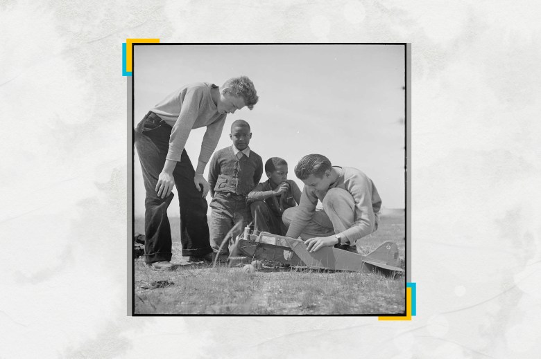 The original caption written in 1940 reads: "Oakland, California. High School Youth. Two Negro Youngsters look over the shoulders a couple fortunate enough to own amodel plane. The white boys can hope to become aviators." Photograph by Federal Security Agency. National Youth Administration.