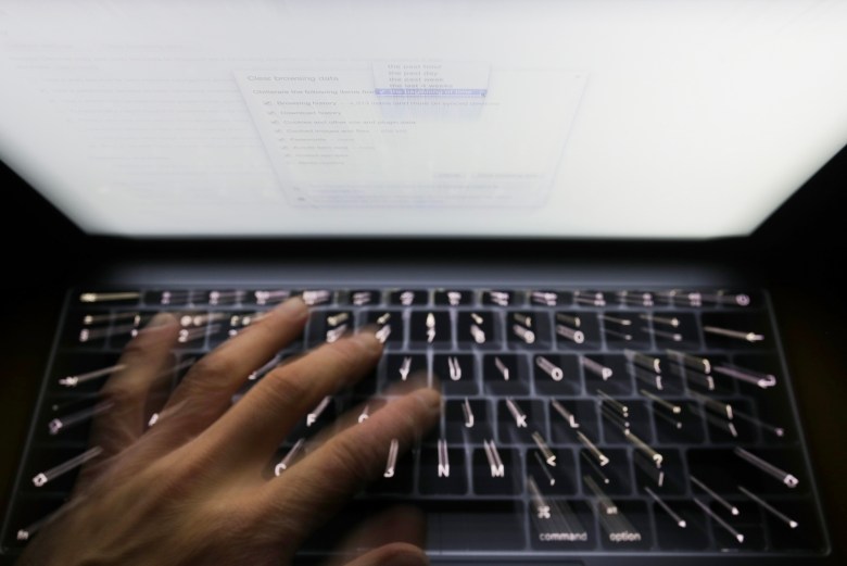 A person using a computer. Photo by Yui Mok, PA via AP Images