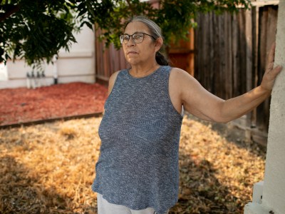 Chris Cummins is photographed outside the home she shares with her daughter and grandchildren in Martinez on. Aug. 27, 2021. Cummins, who is not eligible for Golden State Stimulus payments because she doesn't earn income from work, says she will not vote in the upcoming recall election. Photo by Anne Wernikoff, CalMatters