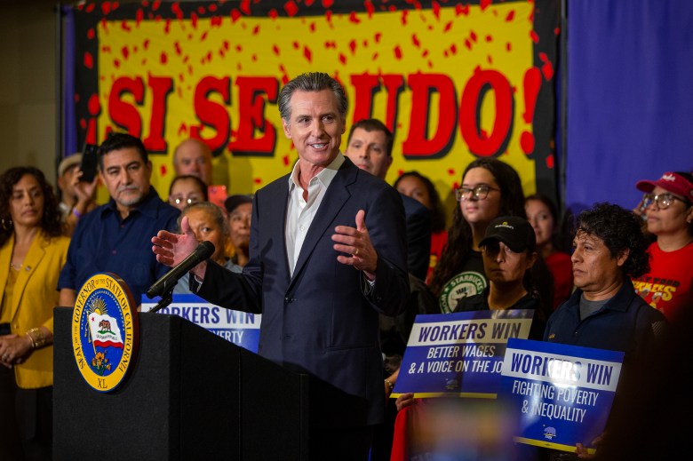 Gov. Gavin Newsom addresses the room before signing legislation supporting the rights of fast food workers and boosting wages to $20 an hour, starting in April of 2024, during a press conference at SEIU Local 721 in Los Angeles on Sept. 28, 2023. Photo by Alisha Jucevic for CalMatters