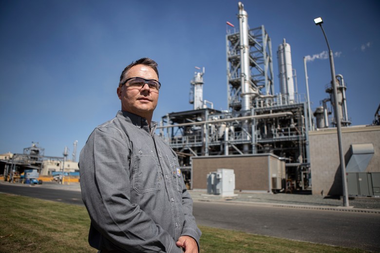 CalGren CEO Travis C. Lane walks through the ethanol plant at the CalGren facility on Sept. 27, 2023.The facility produces renewable natural gas from the methane of several farms with digesters. Photo by Larry Valenzuela, CalMatters/CatchLight Local