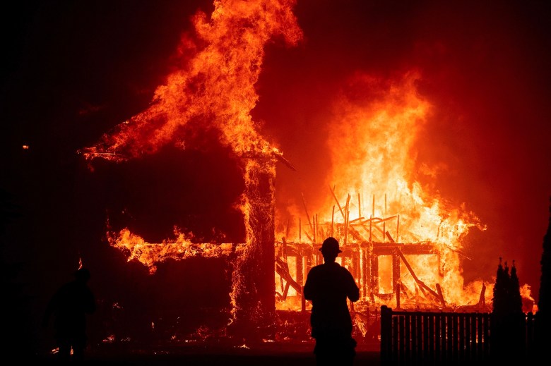 A home burns as the Camp Fire rages through Paradise on Nov. 8, 2018. Photo by Noah Berger, AP Photo