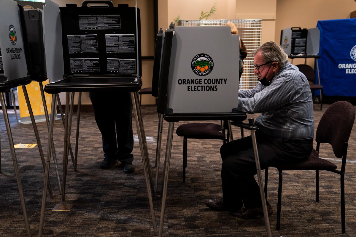 Two voters cast their ballots at a vote center, in Huntington Beach Sept. 14, 2021. Photo by Jae C. Hong, AP Photo