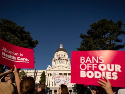 Pro-abortion rights supporters marched in protest of a Supreme Court ruling that overturned Roe vs. Wade, in Sacramento on June 25, 2022. Photo by Miguel Gutierrez Jr., CalMatters